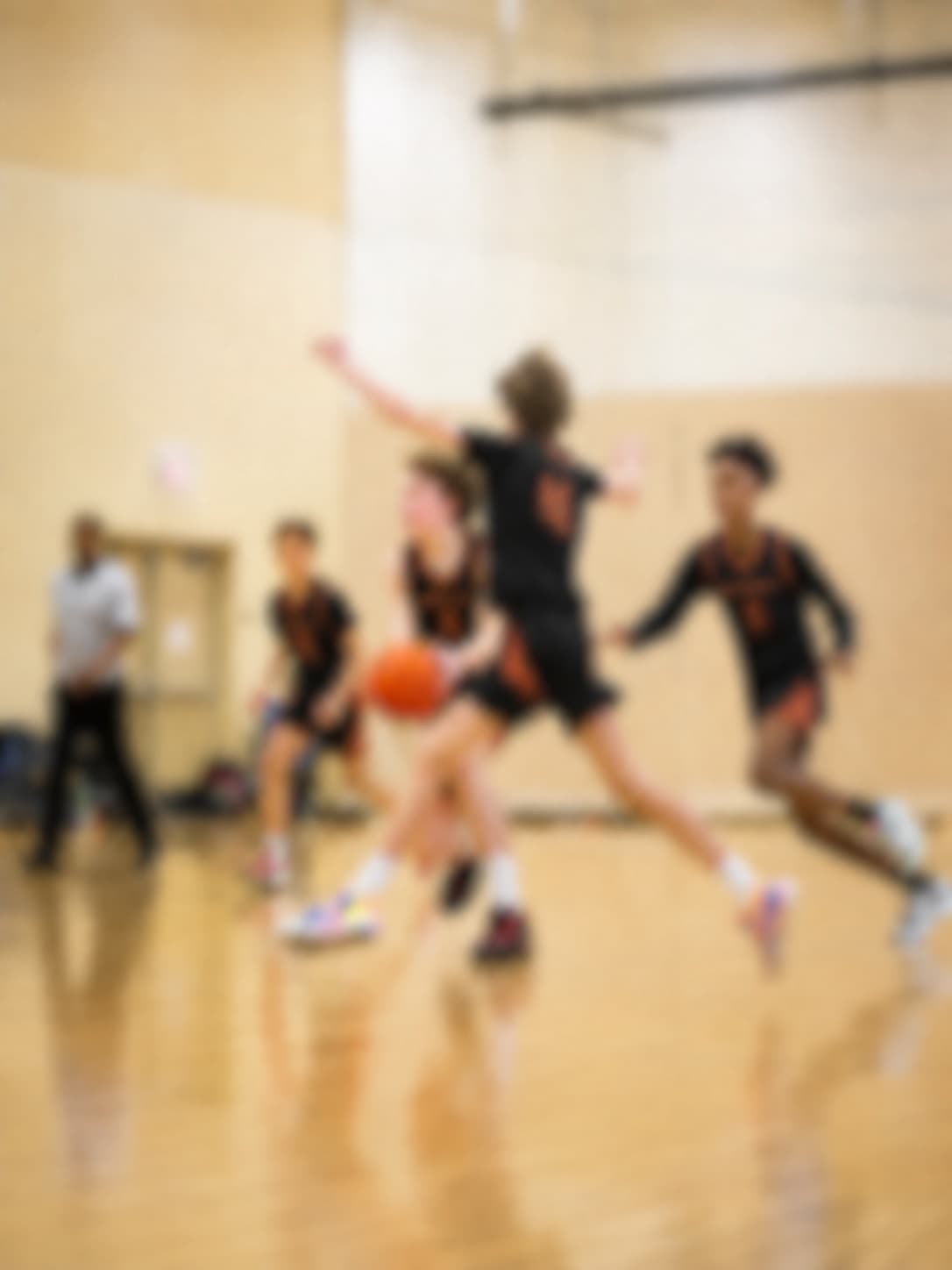 Athlete driving to the basket during a live evaluation game